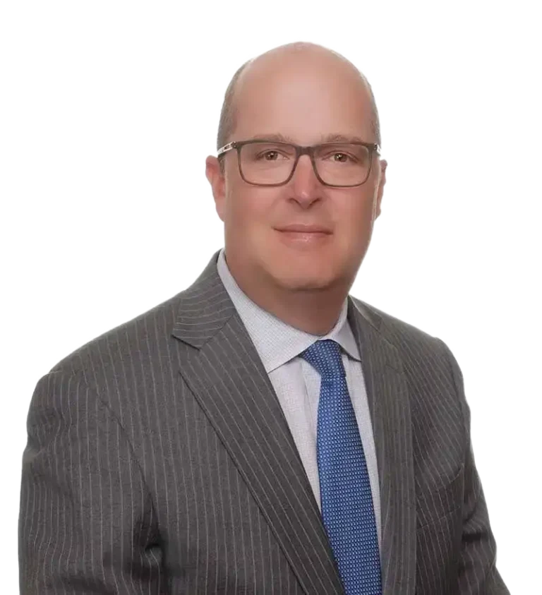 Professional portrait of a middle-aged man wearing glasses, gray pinstripe suit, white shirt, and blue tie.