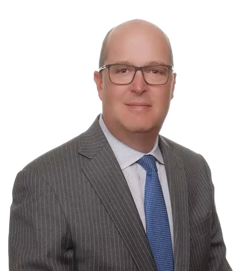 Professional portrait of a middle-aged man wearing glasses, gray pinstripe suit, white shirt, and blue tie.